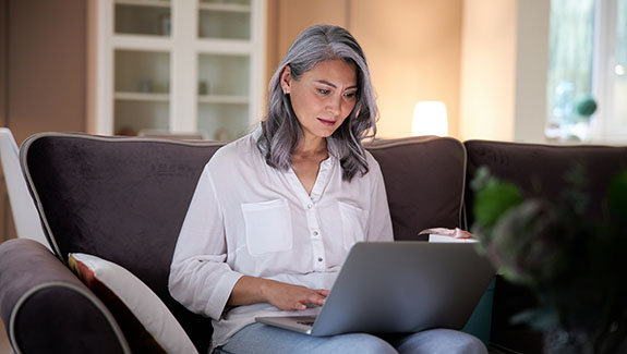 woman-viewing-laptop-at-home-WOCN-continuing-education-575x325